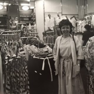 Audrey White in a clothes shop