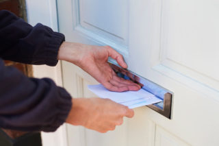 Postman delivering letter